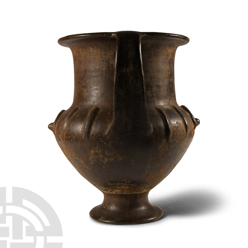Circa 750-700 B.C. Comprising a wide foot beneath a squat stem with a bulbous bo...