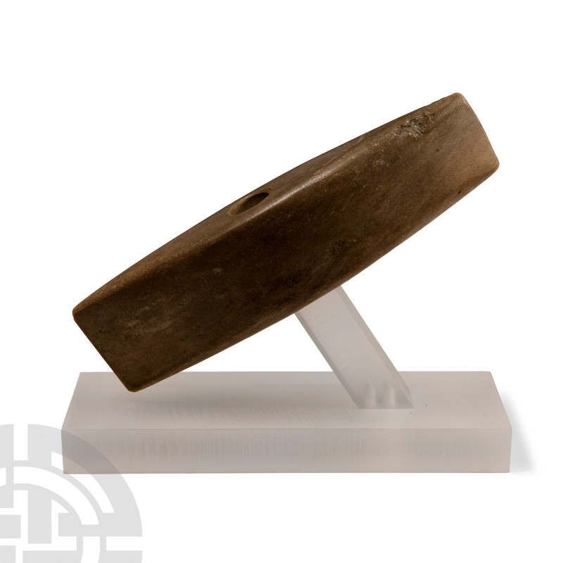 Neolithic, 3rd millennium B.C. Boat-shaped in plan with central drilling; small ...
