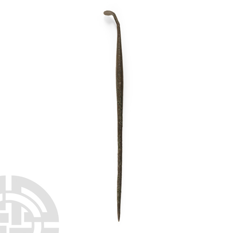 6th-7th century A.D. With angled disc finial, bulb to the shaft. 3.56 grams, 98 ...
