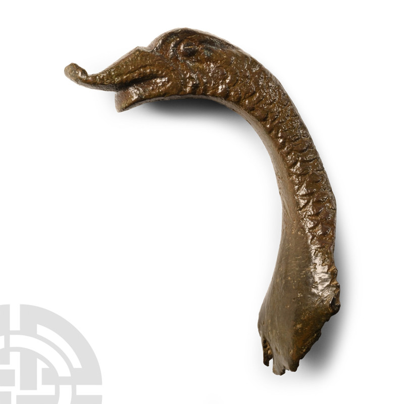 12th-15th century A.D. Lug handle with broad plate and scalloped edge developing...