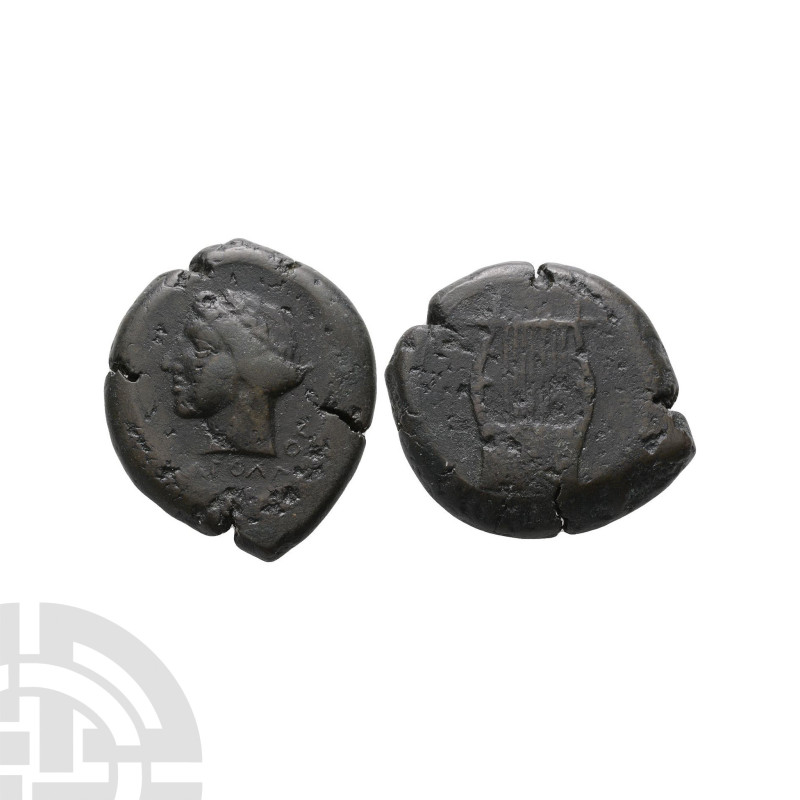 344-336 B.C. Obv: laureate head of Apollo left. Rev: APOL beneath lyre with seve...