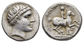 KINGS of MACEDON. Philip II (359-336 BC). 1/5 Tetradrachm. Minted in Akarnania.

Obv: Head of young male right, wearing tainia.
Rev: ΦΙΛΙΠΠΟΥ.
Youth o...