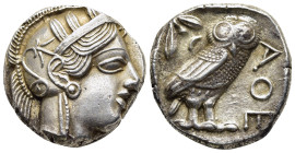 ATTICA. Athens. Tetradrachm (circa 454-404 BC).

Obv: Helmeted head of Athena right, with frontal eye.
Rev: AΘE
Owl standing right, head facing; olive...