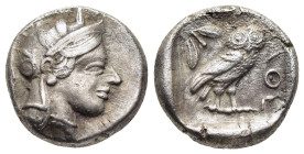 ATTICA. Athens. Drachm (circa 454-404 BC).

Obv: Helmeted head of Athena right, with frontal eye.
Rev: AΘE
Owl standing right, head facing; olive spri...