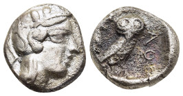 ATTICA. Athens. Drachm (circa 454-404 BC).

Obv: Helmeted head of Athena right, with frontal eye.
Rev: AΘE
Owl standing right, head facing; olive spri...