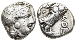 ATTICA. Athens. Tetradrachm (circa 353-294 BC).

Obv: Helmeted head of Athena right, with profile eye.
Rev: AΘE
Owl standing right, head facing; olive...
