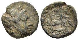 ACHAIA. Pellene. Ae (circa 325-300 BC). 

Obv: Laureate head of Apollo to right. 
Rev: Monogram of ΠΕ above head of ram to right; all within olive wre...