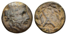 ACHAIA. Achaian League. Dyme(?). Ae (mid 3rd century BC). 

Obv: Laureate head of Zeus to right. 
Rev: Monogram of AX within wreath tied at the top. 
...