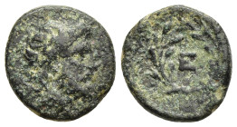 ARGOLIS. Epidauros. Ae (circa 265-255 BC). 

Obv: Laureate and bearded head of Asklepios to right. 
Rev: Ε within laurel wreath tied at the bottom.

B...