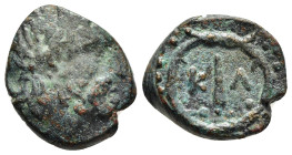 ARGOLIS. Kleonai. Ae (circa 320 BC). 

Obv: Laureate head of Zeus to right.
Rev: Club, K-Λ flanking; all within wild celery wreath. 

BCD Peloponnesos...