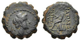 SELEUKID KINGS. Antiochos IV Epiphanes (175-164 BC). Serrate Ae. Ake-Ptolemaïs mint. 

Obv: Laureate head of Apollo right; monogram behind.
Rev: BAΣIΛ...