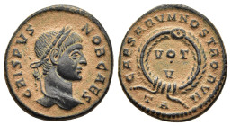 CRISPUS (Caesar, 316-326). Follis. Arelate.

Obv: CRISPVS NOB CAES.
Laureat head right.
Rev: CAESARVM NOSTRORVM // TA
VOT / V in two lines within wrea...
