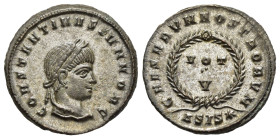 CONSTANTINE II (Caesar, 316-337). Follis. Siscia.

Obv: CONSTANTINVS IVN NOB C.
Laureate head right.
Rev: CAESARVM NOSTRORVM // ΔSIS (star).
VOT / V i...