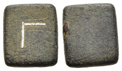 BYZANTINE EMPIRE. Commercial weight (5h- 7th century AD). Uncertain standard.

A square bronze weight. The top bears the letter Γ inlaid in silver.

C...