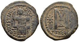 JUSTINIAN I (527-565). Follis. Antioch.

Obv: D N IVSTINIANVS P P AVG.
Justinian enthroned facing, holding long sceptre and globe cruciger.
Rev: Large...