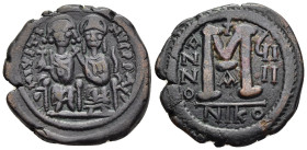 JUSTIN II (565-578). Follis. Nicomedia. Dated RY 9 (573/4).

Obv: D N IVSTINVS P P AVC.
Justin, holding globus cruciger, and Sophia, holding cruciform...