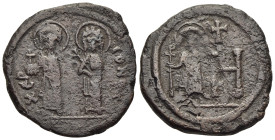 JUSTIN II (565-578). 8 Pentanummia – Follis. Cherson mint.

Obv: XEP CONOC, Justin and Sophia standing facing. 
Large H; to left, Tiberius, nimbate, s...