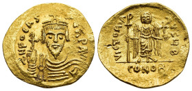 PHOCAS (602-610). GOLD Solidus. Constantinople.

Obv: O N FOCAS PЄRP AVG
Crowned and cuirassed bust facing, holding globus cruciger.
Rev: VICTORIA AVG...