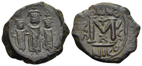HERACLIUS with MARTINA and HERACLIUS CONSTANTINE (610-641). Follis. Nicomedia. Dated RY 7.

Obv: Heraclius, in centre, flanked by Martina, on left, an...