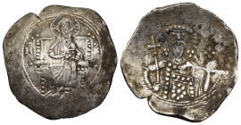ALEXIUS I COMNENUS (1081-1118). Billon Trachy. Constantinople.

Obv: Christ Pantokrator seated facing on throne.
Rev: Facing bust of Alexius, holding ...