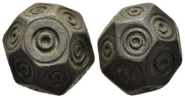 ISLAMIC WEIGHTS (circa 10-13th centuries). Commercial weight of 10 Dirhams or 1 Uqiya. Bronze.

A coin weight in the form of a polyhedron; decorated w...