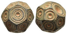 ISLAMIC WEIGHTS (circa 10-13th centuries). Commercial weight of 5 Dirhams or 1/2 Uqiya. Bronze.

An islamic coin weight in the form of a polyhedron; d...
