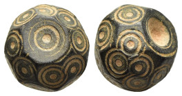 ISLAMIC WEIGHTS (circa 10-13th centuries). Commercial weight of 2 Dirham. Bronze.

An islamic coin weight in the form of a polyhedron; decorated with ...