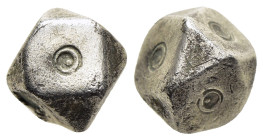 ISLAMIC WEIGHTS (circa 10-13th centuries). Commercial weight of 2 Dirham. SILVER.

An islamic coin weight in the form of a polyhedron; decorated with ...