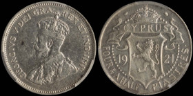 CYPRUS: 4- 1/2 Piastres (1921) in silver (0,925). Crowned bust facing left on obverse. Crowned coat of arms divide date, denomination below on reverse...
