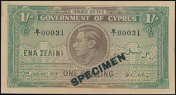 CYPRUS: Specimen of 1 Shilling (3.1.1939) in brown and green. Portrait of King George VI at center on face. S/N: "B/1 00031". Black diagonal ovpt "SPE...