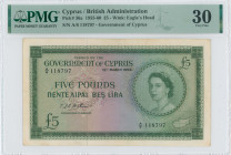 CYPRUS: 5 Pounds (15.3.1958) in green on multicolor unpt. Portrait of Queen Elizabeth II at right and map of Cyprus at lower right on face. S/N: "A/6 ...