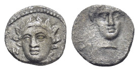 CILICIA, Nagidos. Circa 400-380 BC. AR Obol (8mm, 0.7 g) Wreathed head of young Dionysos facing slightly left. Rev: Head of Aphrodite facing slightly ...