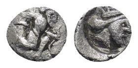 CILICIA, Uncertain. Early-mid 4th century BC. AR Tetartemorion (5mm, 0.12 g). Persian king or hero in kneeling-running stance right, holding dagger an...