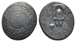 Kings of Macedon. Philip III Arrhidaios, 323-317 BC. Æ (14mm, 3.7 g). Sardes mint. Macedonian shield, kerykeion (caduceus) on boss. / Macedonian helme...