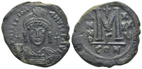 JUSTINIAN I. 527-565. Æ Follis (32mm - 17.7 g). Constantinople mint. Dated Year 35 (562/3). Helmeted and cuirassed bust facing, holding globus crucige...
