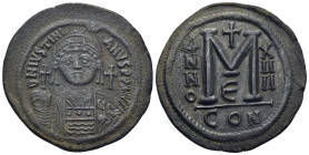 Justinian I Æ Nummus. (39mm, 21.3 g) Constantinople, (Dated RY 14=540/1 AD). D N IVSTINIANVS P P AVG, Helmeted, draped, and cuirassed bust facing, hol...
