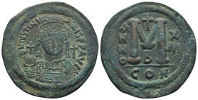 Justinian I. AD 527-565. Dated year 13 = 539-540 AD. Constantinople Follis Æ )40mm., 23.4 g). DN IVSTINIANVS PP AVG, helmeted and cuirassed bust facin...