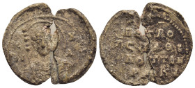 BYZANTINE LEAD SEAL. (25mm, 5.35 g) Obv: Nimbate facing bust of Saint George, holding spear over his right shoulder and shield on his left arm Rev: Le...