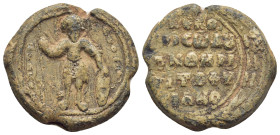 BYZANTINE LEAD SEAL. (26mm, 14.22 g) Obv: Saint Theodore, nimbate, standing facing, holding spear and shield. Rev: Legend in 4 lines.