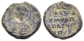 BYZANTINE LEAD SEAL. (18mm, 5.3 g) Obvlead: Nimbate facing bust of Saint Nicholas, raising his right hand in benediction and holding book of Gospels i...