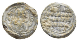BYZANTINE LEAD SEAL. (13mm, 3.35 g) Obv: Bust of the Virgin Mary facing, orans, with Christ medallion on breast . Rev: Legends in 4 lines.