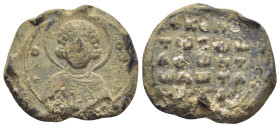 BYZANTINE LEAD SEAL. (25mm, 12.8 g) Obv: Facing bust of Saint Nicholas, nimbate, raising his right hand in benediction and holding a book of Gospels i...