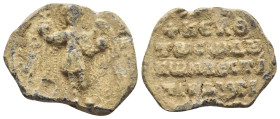 BYZANTINE LEAD SEAL. (25mm, 8.9 g) Obv: St. Michael standing facing, wearing loros and holding trefoil scepter in his right hand and globe in his left...