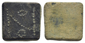 Byzantine Weight (5th-7th centuries) Weight of 1 Nomisma (13mm., 4,4 g.) Obv: Square coin weight, engraved N, one pellet to right, one pellet below Re...