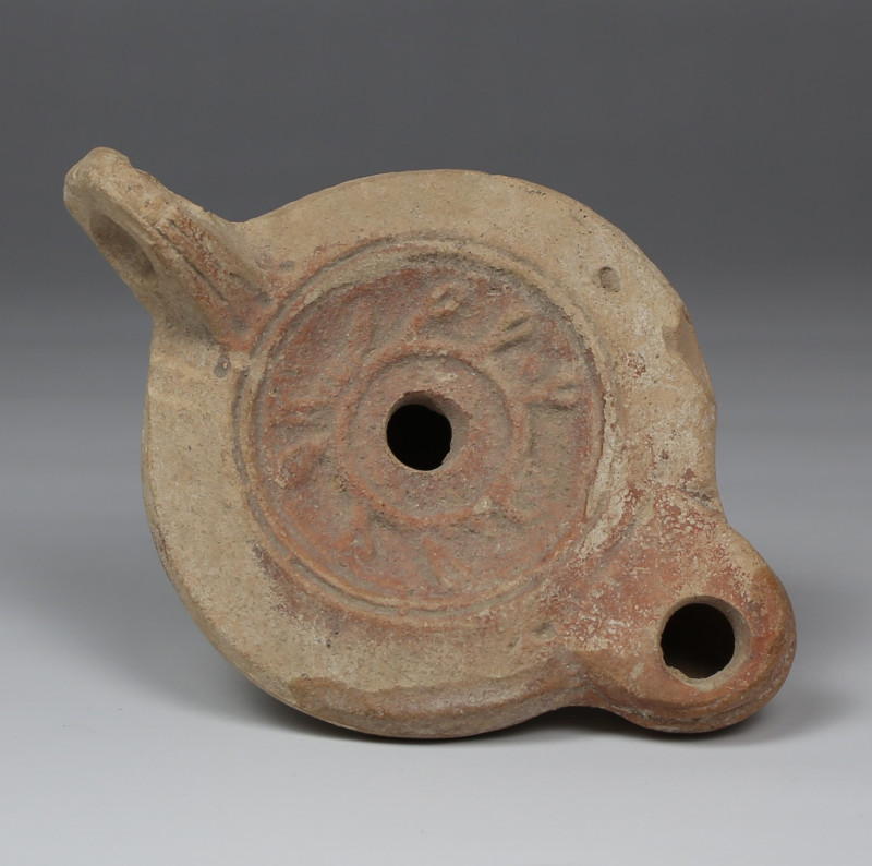 Roman factory oil lamp depicting Myrtle wreath with makers mark, Type Bussière D...