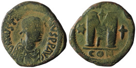 Justinian I. (527-565 AD) Æ Follis. Constantinople. Obv: D N IVSTINIANVS PP AVI. diademed bust right. Rev: M between stars, cross above. artificial sa...