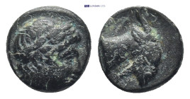Aiolis, Aigai. Ca 3rd century B.C. AE (9mm, .7 g). Laureate head of Apollo to right / Head and neck of goat right