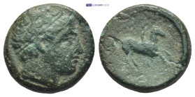 KINGS OF MACEDON. Philip II (359-336 BC). Ae. (5.8 g. 17mm). Uncertain mint in Macedon. Obv: Diademed head of Apollo right. Rev: Youth on horse rearin...