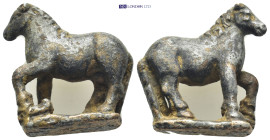 Horse figurine. (27mm, 16.7 g) Bronze advancing horse, r; raising l. paw.
