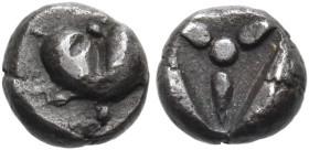 KYRENAIKA. Kyrene. Circa 550-500 BC. Hemiobol (Silver, 5.5 mm, 0.39 g). Silphium fruit. Rev. Three lotus buds with a central pellet; all within an inc...